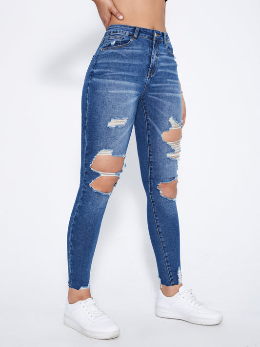 بنطلون جينز نحيل قص مجوف ممزق بحافة مهتري الحواف