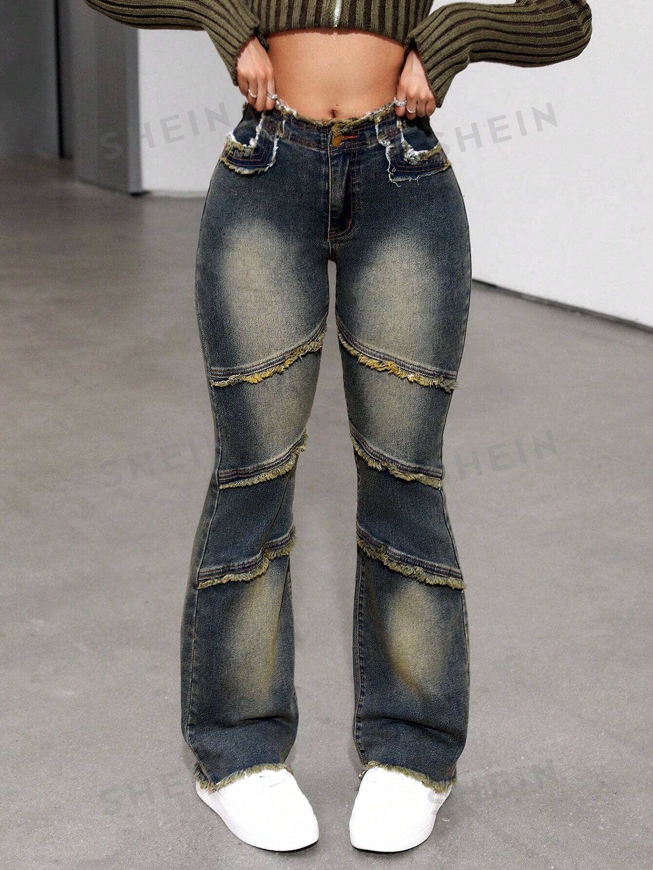 بنطلون جينز موسع للساقين بطرف ممزق مغسول بالماء