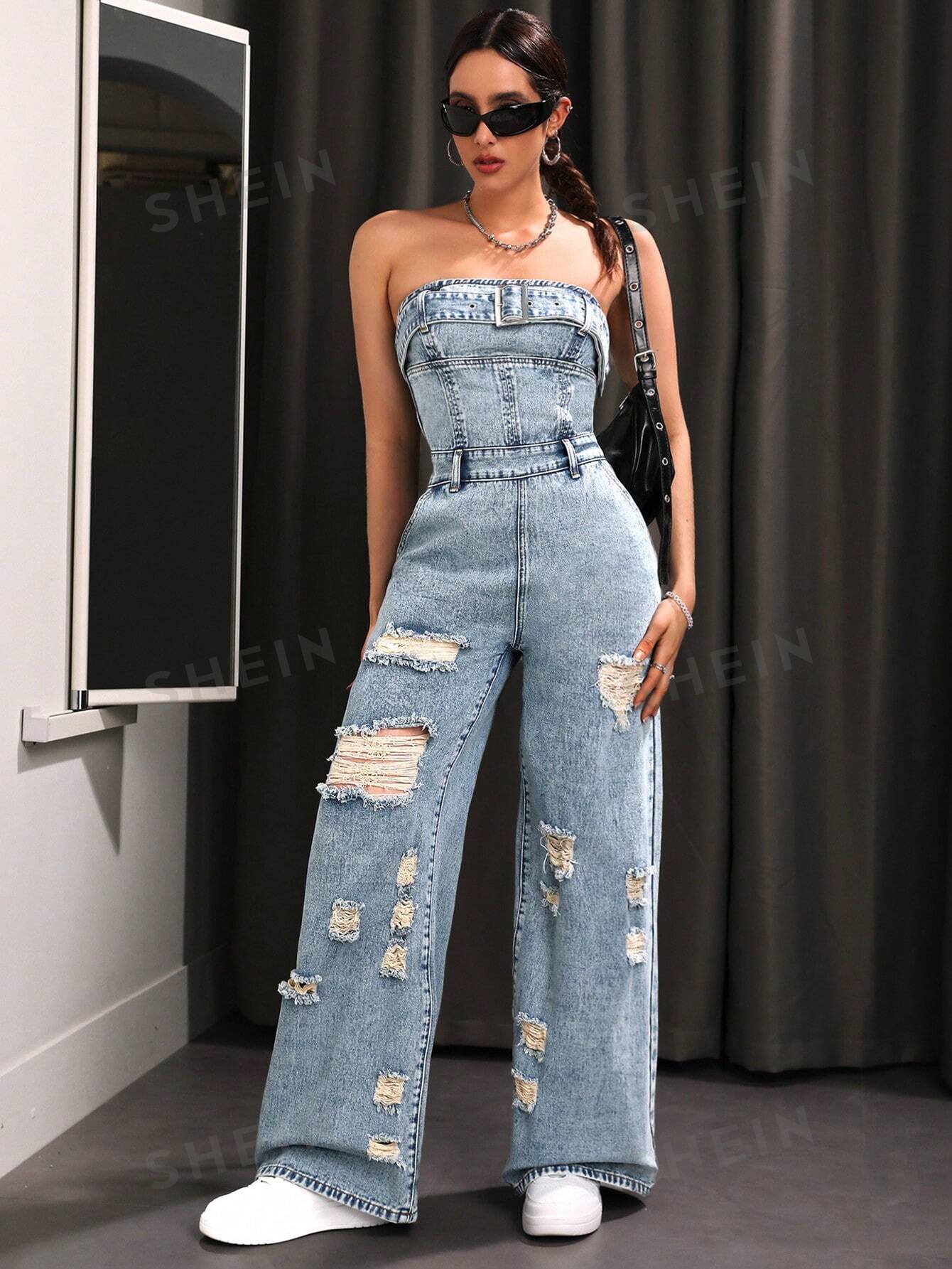 بذلة من قماش الدنيم الممزق المغسول