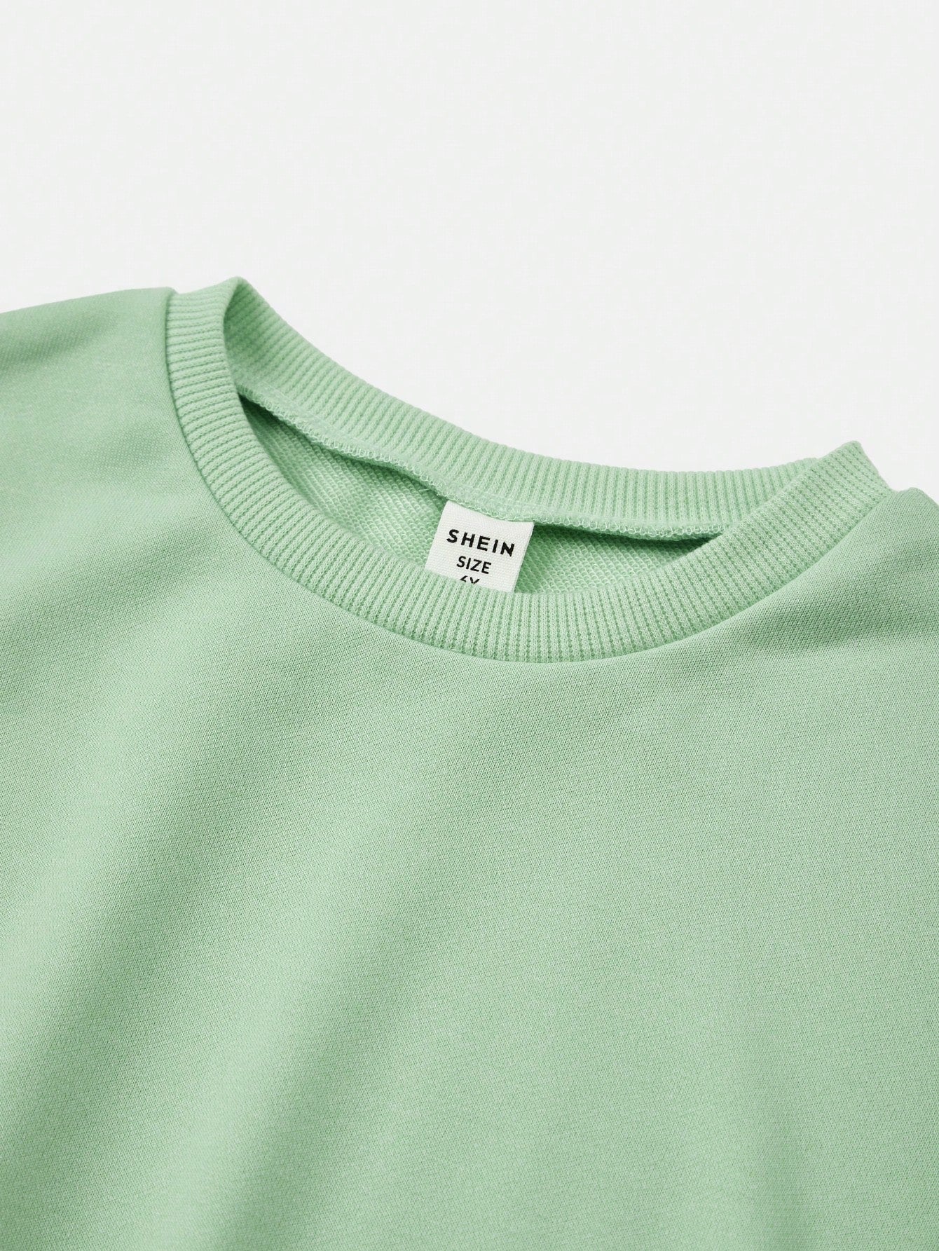 بلوزة رياضية كبيرة الحجم بياقة مستديرة وأكمام طويلة للبنات الصغيرات