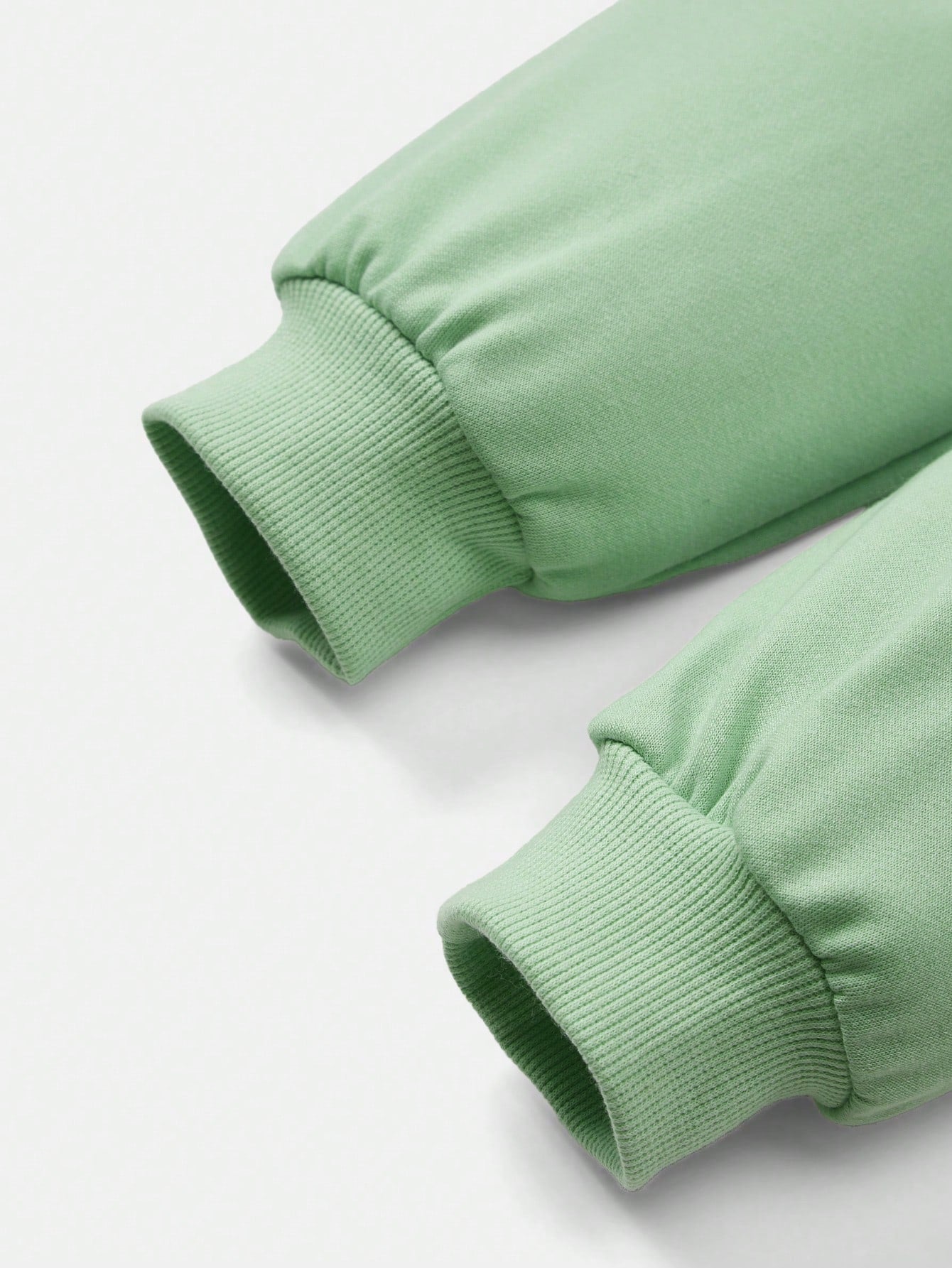 بلوزة رياضية كبيرة الحجم بياقة مستديرة وأكمام طويلة للبنات الصغيرات