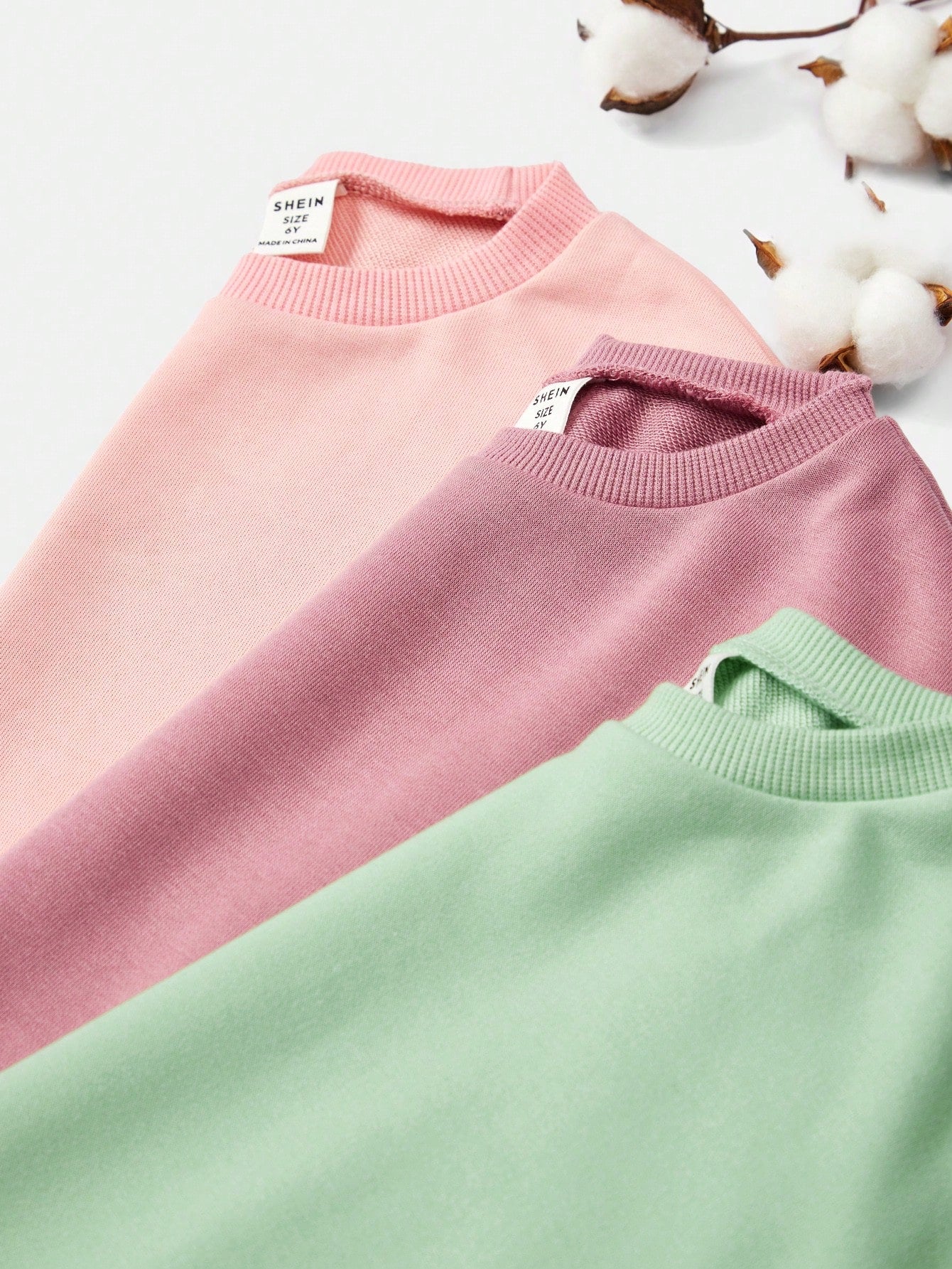 بلوزة رياضية كبيرة الحجم بياقة مستديرة وأكمام طويلة للبنات الصغيرات