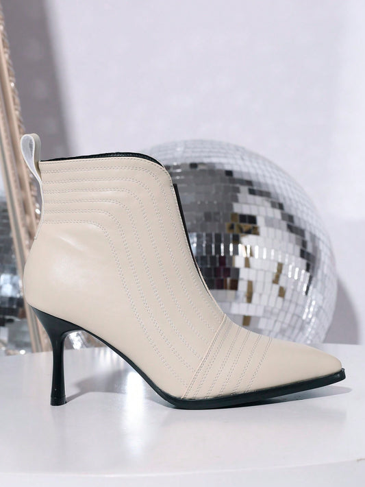 بوت كاحل نسائي أنيق برقبة عالية بنعل رفيع وسحاب جانبي