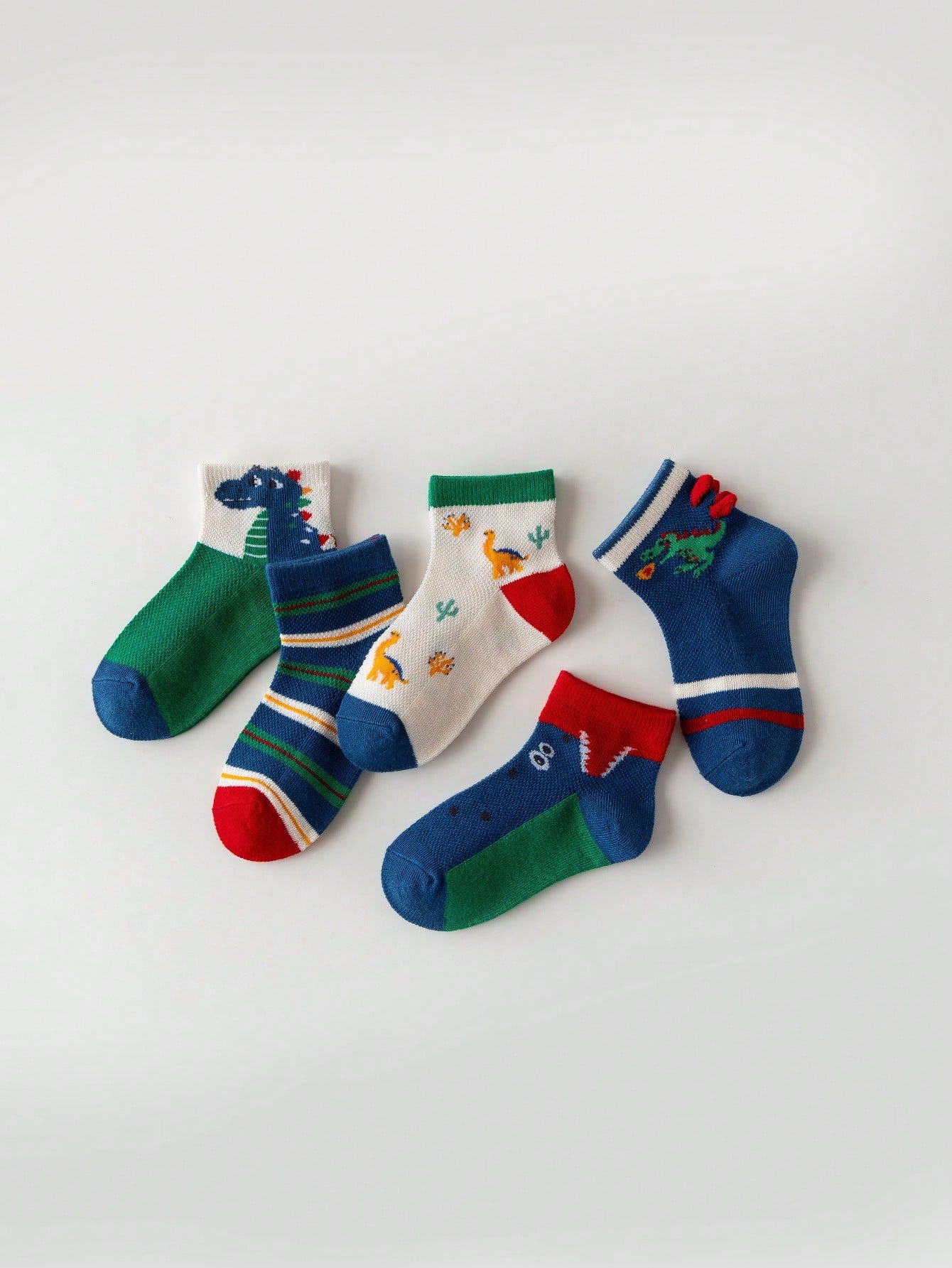 زوج واحد من الجوارب المخططة على شكل ديناصور وأسد