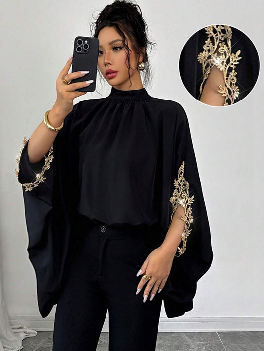 بلوزة نسائية أنيقة فضفاضة باللون الأسود