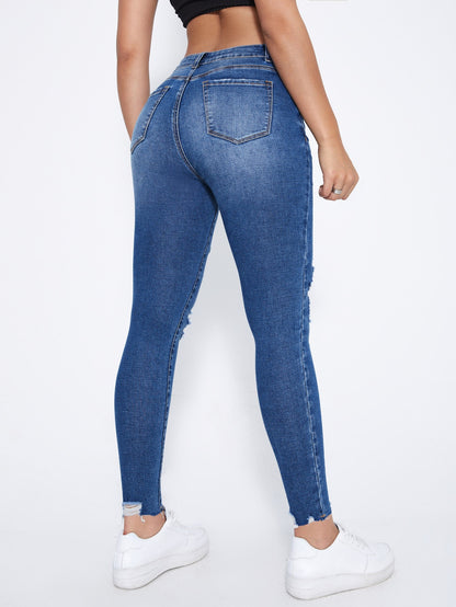 بنطلون جينز نحيل قص مجوف ممزق بحافة مهتري الحواف