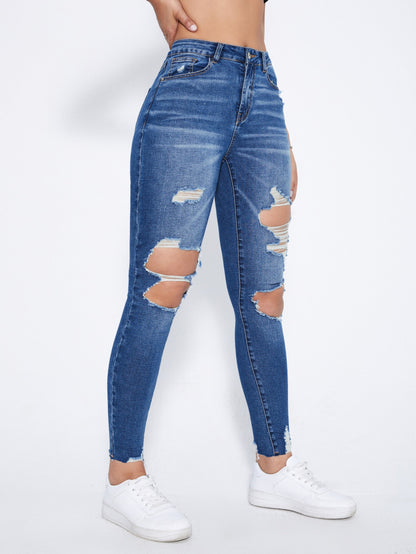 بنطلون جينز نحيل قص مجوف ممزق بحافة مهتري الحواف
