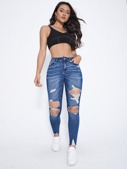 بنطلون جينز نحيل قص مجوف ممزق بحافة مهتري الحواف