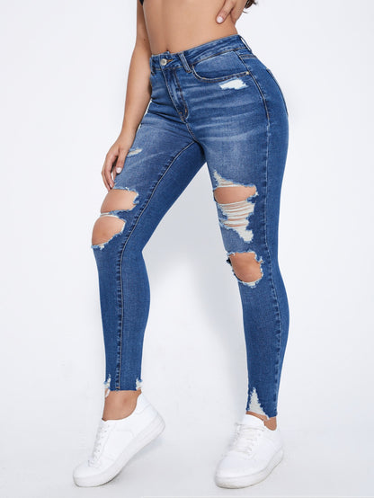 بنطلون جينز نحيل قص مجوف ممزق بحافة مهتري الحواف