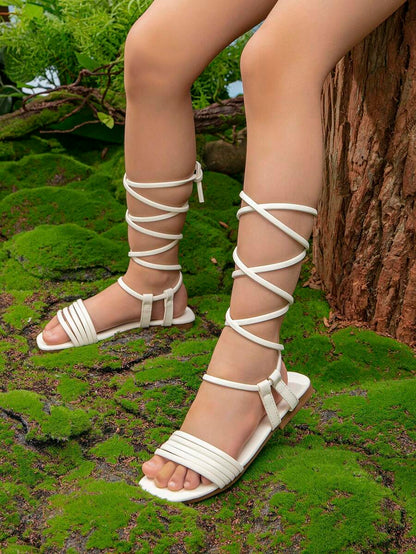 صنادل بأشرطة ربطة ساق تصميم مسطح الموضة أبيض بنات