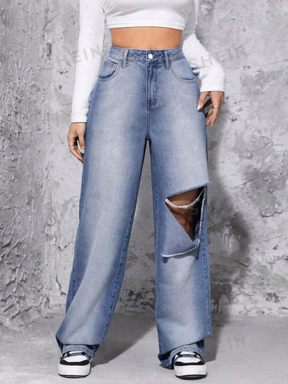 جينز ممزق عالي الخصر وواسع الساق