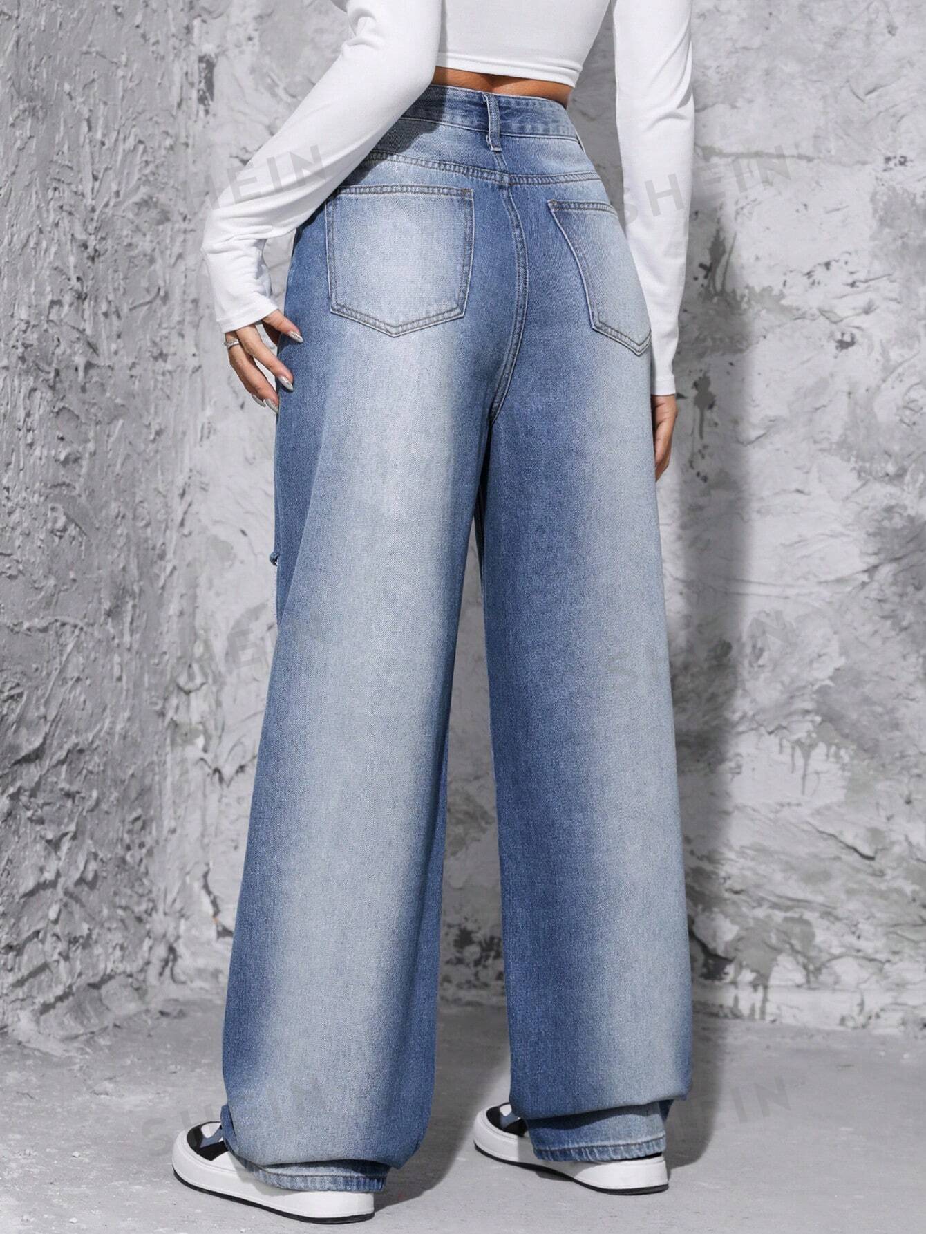 جينز ممزق عالي الخصر وواسع الساق