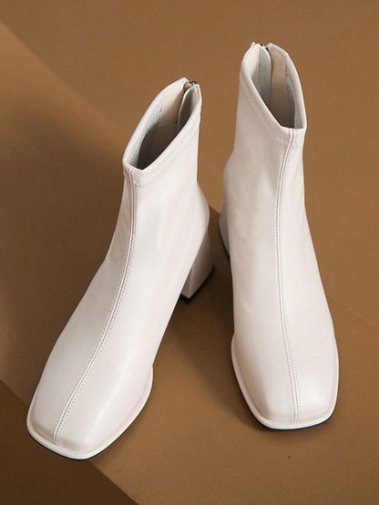 حذاء بوتي مدبب بكعب مرتفع معتدل للسيدات ذوي الكعب السميك بنمط فرنسي نعل مدبب مثالي للفساتين