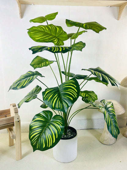 نبات صناعي كبير بحجم 35.48 بوصة ب-18 فرع تمثل أوراق كأنها ظهر السلحفاة وأوراق الأناناس الخضراء مزينة بأوراق كبيرة مخططة مصطنعة للتزيين يستخدم في المكاتب و غرف المعيشة و غرف النوم والمطابخ مصنوع من بلاستيك صناعي خضراء لا يأتي مع الأواني الزراعية