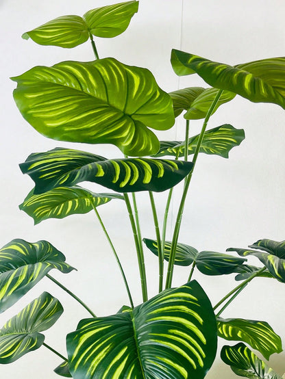 نبات صناعي كبير بحجم 35.48 بوصة ب-18 فرع تمثل أوراق كأنها ظهر السلحفاة وأوراق الأناناس الخضراء مزينة بأوراق كبيرة مخططة مصطنعة للتزيين يستخدم في المكاتب و غرف المعيشة و غرف النوم والمطابخ مصنوع من بلاستيك صناعي خضراء لا يأتي مع الأواني الزراعية