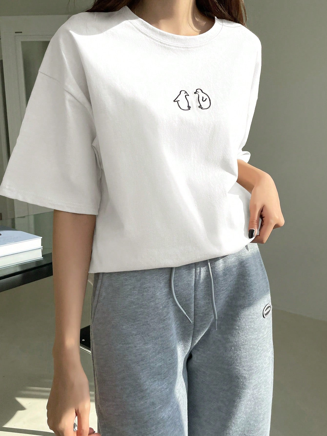 تي شيرت بأكمام قصيرة وتصميم فضفاض