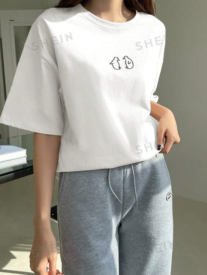 تي شيرت بأكمام قصيرة وتصميم فضفاض