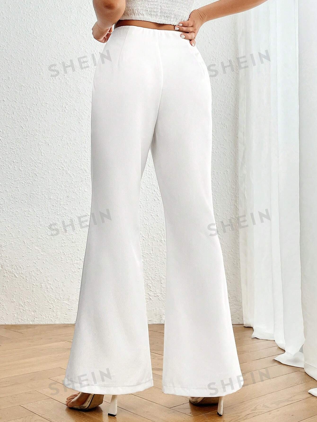 سروال نسائي عالي الخصر عريض مطوي بأسفل بسيط وأنيق بلون صلب