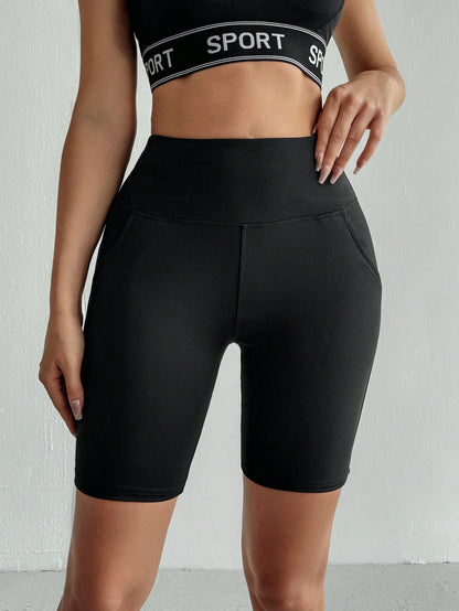 سروال يوغا رياضي نسائي بلون سادة مع جيوب (طول الركبة)