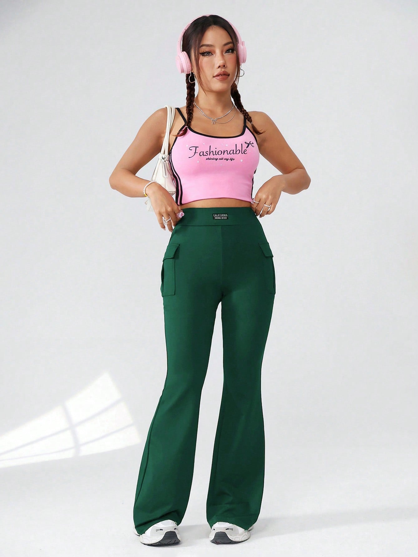 سروال نسائي منسوج بلون ثابت بتصميم جيب و أطراف متسعية