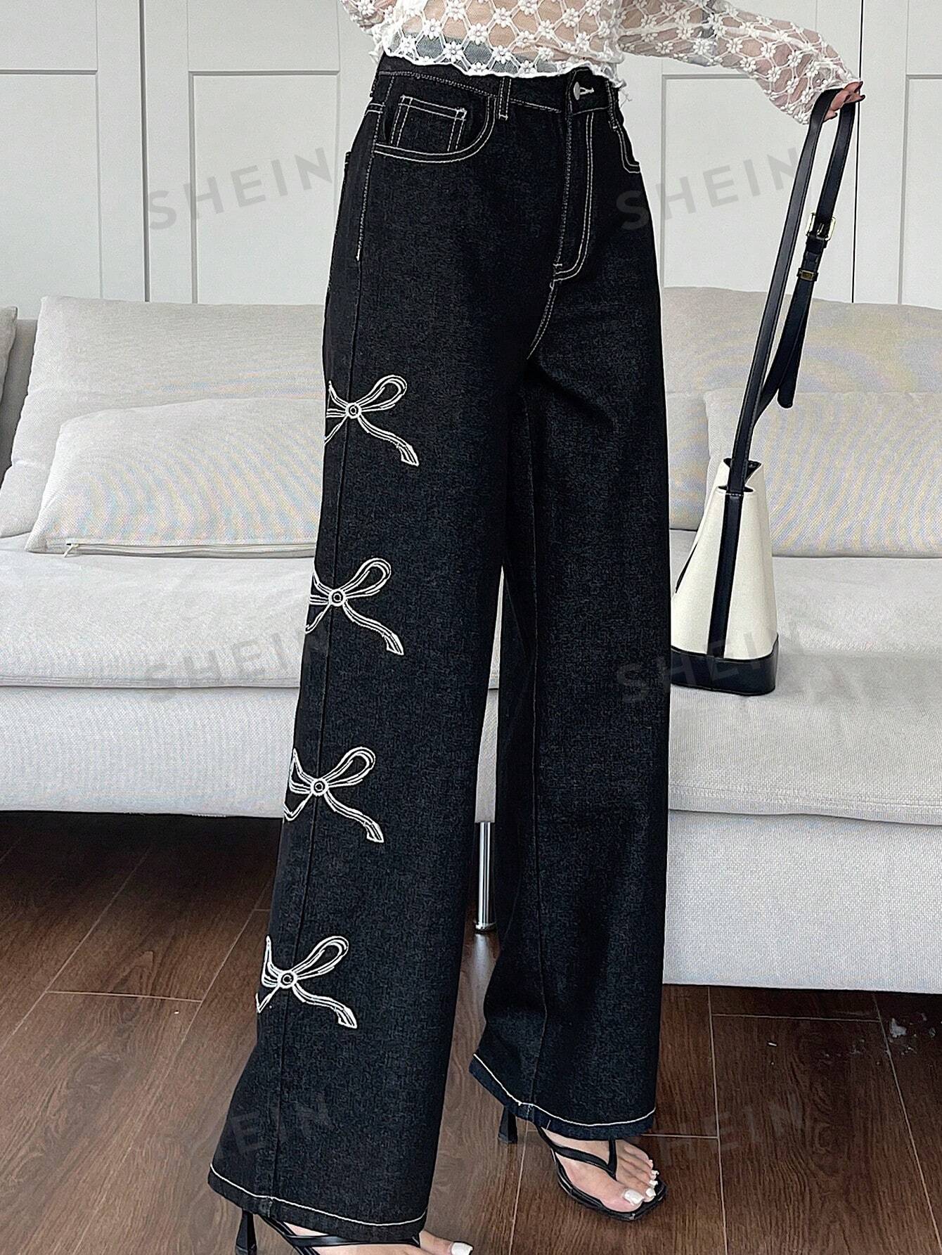 جينز واسع الساقين بطبعة القوس