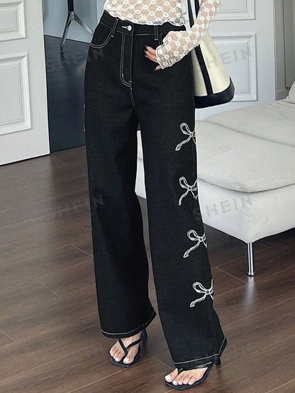 جينز واسع الساقين بطبعة القوس