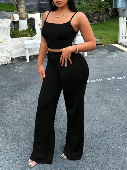 طقم سترة حمالة وبنطلون باللون الأحادي للنساء