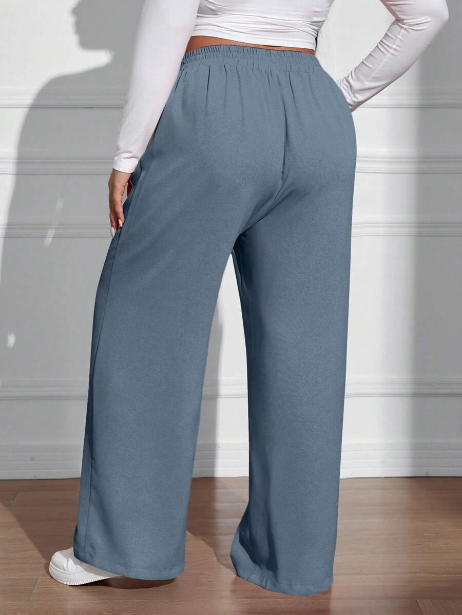 سراويل فضفاضة كاجوال واسعة الساق ذات خصر مطاطي موحد اللون للنساء بمقاسات كبيرة