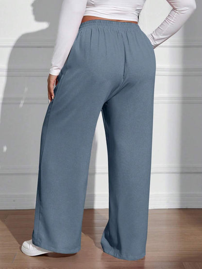 سراويل فضفاضة كاجوال واسعة الساق ذات خصر مطاطي موحد اللون للنساء بمقاسات كبيرة