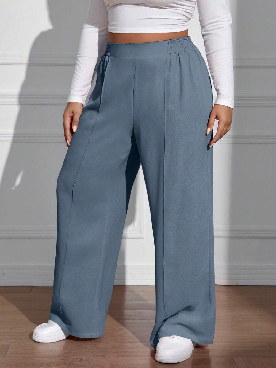 سراويل فضفاضة كاجوال واسعة الساق ذات خصر مطاطي موحد اللون للنساء بمقاسات كبيرة