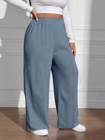 سراويل فضفاضة كاجوال واسعة الساق ذات خصر مطاطي موحد اللون للنساء بمقاسات كبيرة