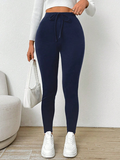 سراويل رياضية لنساء بلون أحادي مع ربطة خصر