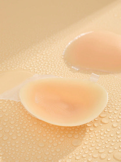 زوج من لاصقات ثدي السيليكون لرفع الصدر باللون المشمشي والشكل الكروي للنساء