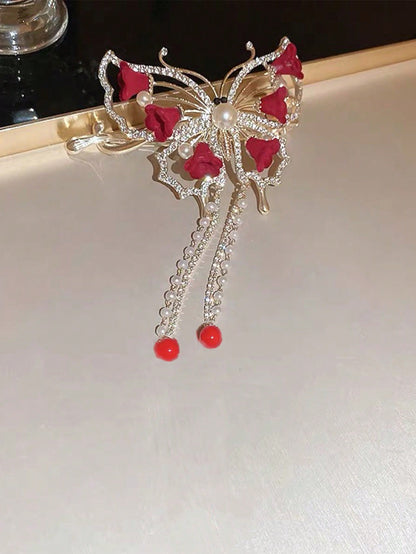 مقطع شعر خفاش ترتواز النسائي بحجر الراين، زنبقة الوادي الحمراء،لفافة الخصلات مناسب للارتداء اليومي والحفلات الأنيقة