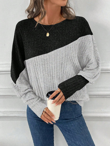 بلوزة رياضية فضفاضة ذات أكمام طويلة على شكل خفاش بألوان متباينة، للنساء