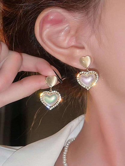 مجموعة أقراط ماسية ذات تصميم هندسي