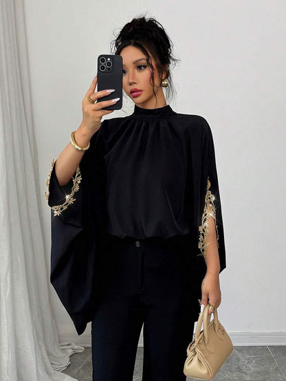 بلوزة نسائية أنيقة فضفاضة باللون الأسود