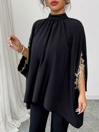 بلوزة نسائية أنيقة فضفاضة باللون الأسود